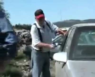 News guy is trying to show the viewers how quick and easy it is for thieves to break into your vehicle and steal your belongings using just a hammer