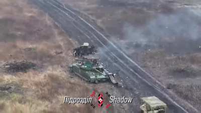 Another video by the Ukrainian "Shadow" drone unit dropping an US M67 grenade skillfully through the cope cage and the open hatch of a damaged Russian MBT.