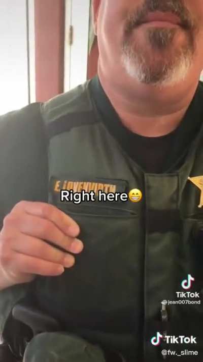 Man gets badge numbers from cops.