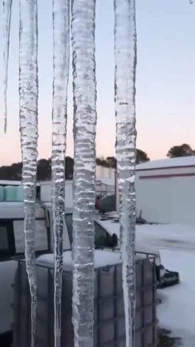 Emkay symbol in ice.