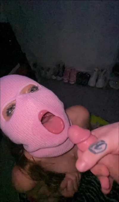 Watch this bad babe take a massive cumshot on her mask