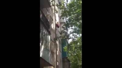 Man falls off a building after pretending to be Spiderman.