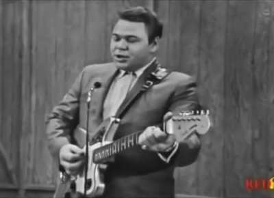 Roy Clark in 1964, performing a more comedic rendition of Johnny Cash's "Folsom Prison Blues"