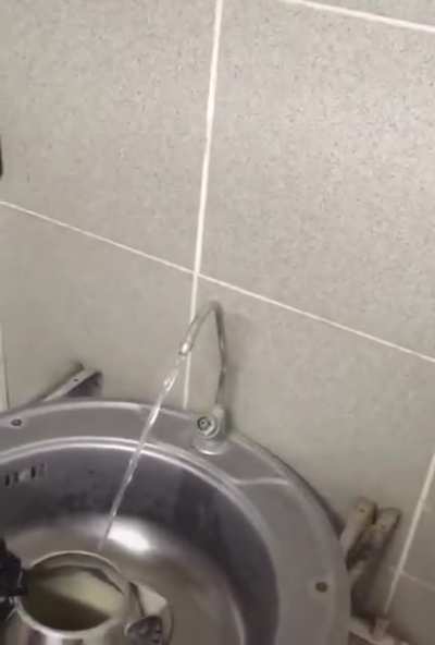 In Soviet Russia, electricity switch turns on water.