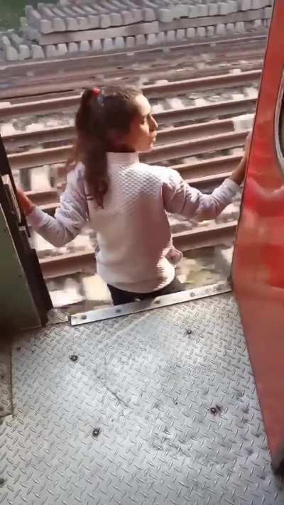 The girl literally jumps out of the running train risking her life