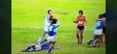 Allan MacMahon of Balmain hits a Newtown opponent with a cracking textbook rib-tickler in the early &lsquo;80s