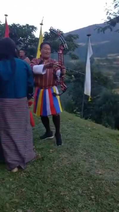 It is a tradition in Bhutan to see if a man can still shoot straight while his manhood is being squeezed.
