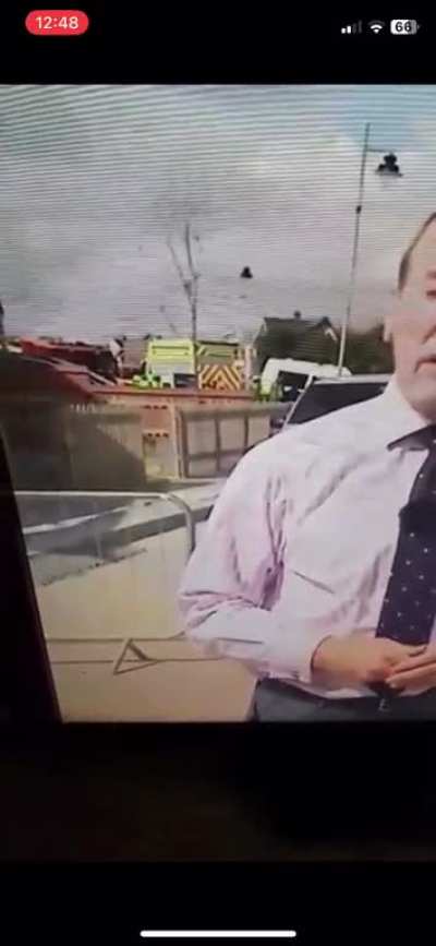 "My mum just had to rewind the news because she swore blind she saw a giraffe running in the background" (found)