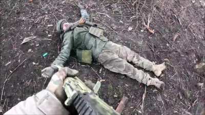 Ukrainian soldiers take Russian POWs inside Avdiivka. 2 February 2024