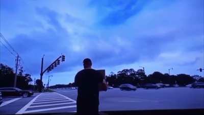 “Concerned citizens” keep calling the cops on a man holding a sign that says “Eat a Bag of D**ks”