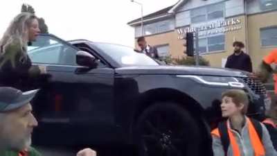 Driver begins to run over Insulate Britain protestors during the school run