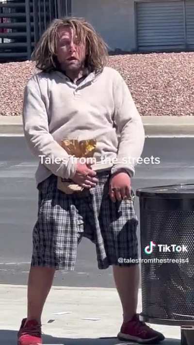 Tweaker by a trashcan