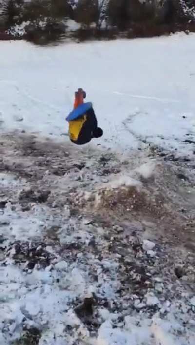Sledding down a rocky cliff