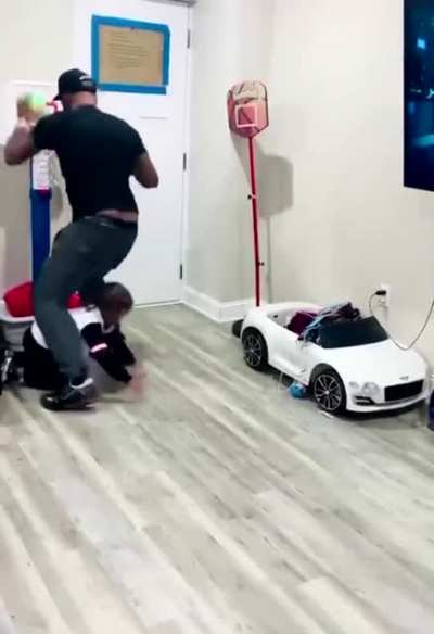 Dad Blocks toddler from shooting a basket and toddler isn&rsquo;t having any of it