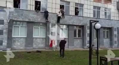 Students jump out of windows to escape a school shooting in Russia