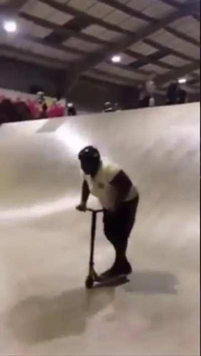Look at this fat nigga on a scooter