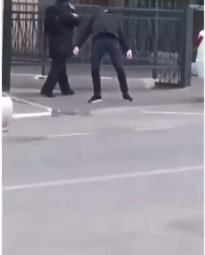 Policeman in Russia not sure what to do with this guy