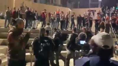 Terrorist occupational forces attacks Palestinians with BROOMS while cleaning the Damascus gate after the march of flags by the settlers herds