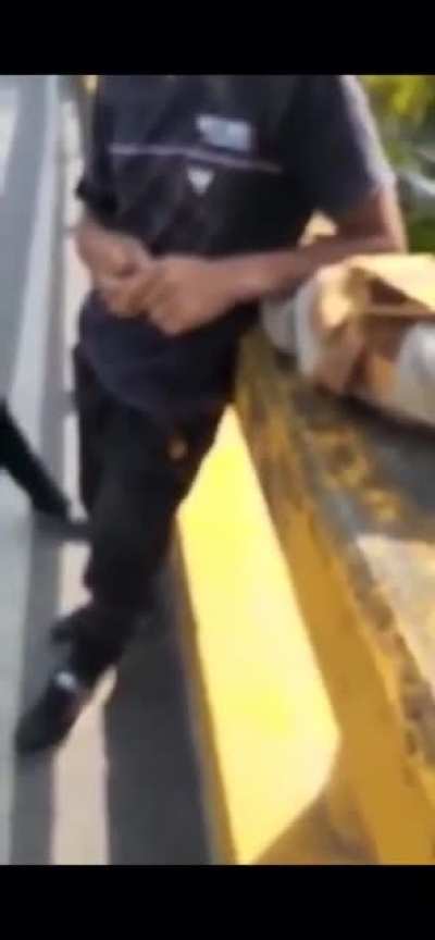 Young man thrown off bridge