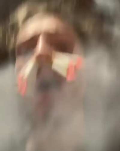 Guy smokes 8 cigarettes at once through his nose