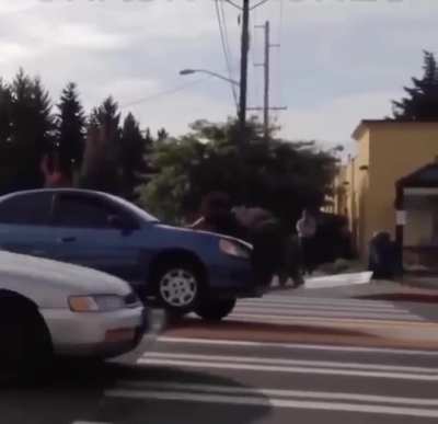 Trying to use the sign you ran over as a lever to free your vehicle.