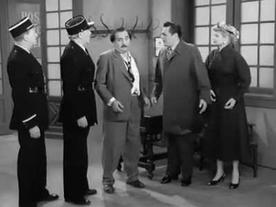 Lucille Ball gets in trouble with the authorities while in Paris, during a 1956 episode of "I Love Lucy". To translate to the cops they get a French officer who speaks German, and a German drunk who knows Spanish... so that Ricky (Desi Arnez) can tell Luc