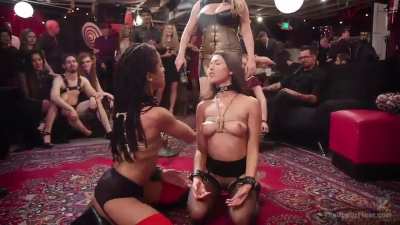 Two girls fucked in a crowded place.