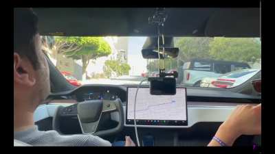 3 Tesla fans compare a Waymo robotaxi to Tesla's "Full Self Driving" in San Francisco and discuss why Tesla's approach is superior while blowing a stop sign, veering into oncoming traffic, and barely preventing the Tesla from crashing into parked cars mul