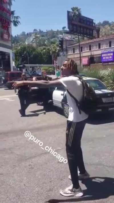 Racist tells an Asian American to go back to China and then physically threatens to "beat his ass" right in front of two cops