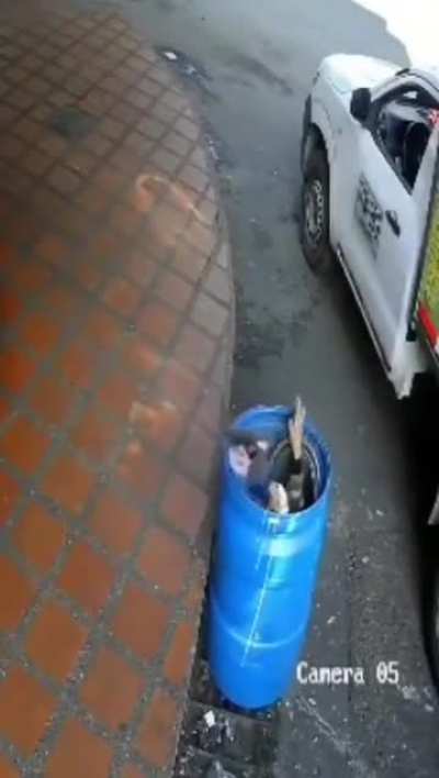 Sitting on a random container by the side of the road