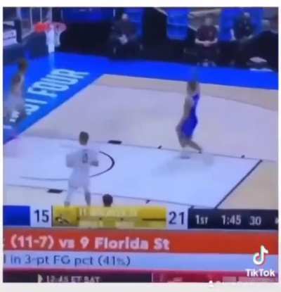 Two players kiss mid dunk and panic