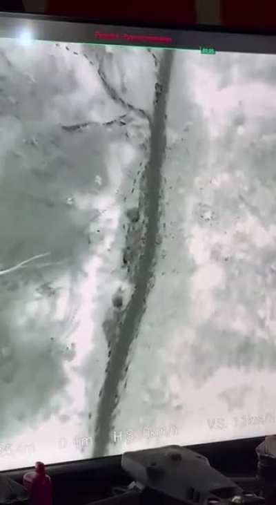 Drone operator POV of a grenade drop on two soldiers of the AFU. One soldier manages to get back up. Zaporizhia Oblast, February 2024.
