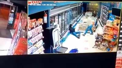He didn't even have time to pull out the weapon. The masked robber got what he deserved.