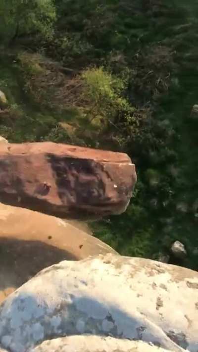 Rolling stone off a cliff!