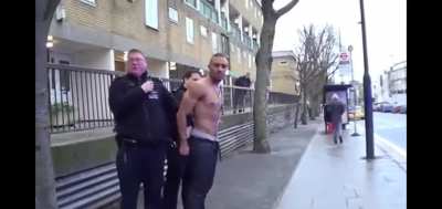 English lad shooting his water pistol during arrest.
