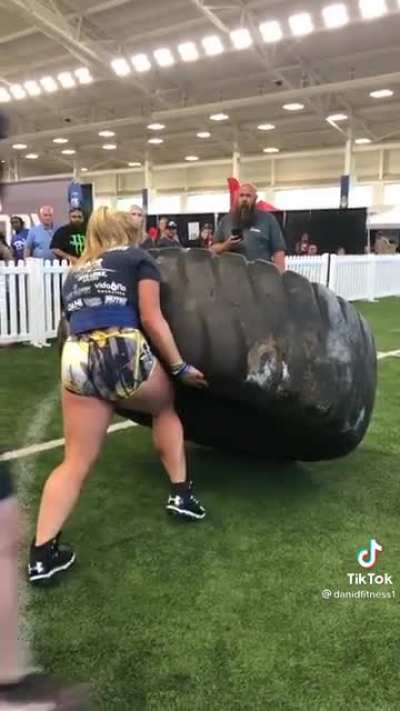 Strongwoman lifts a 500lb tire