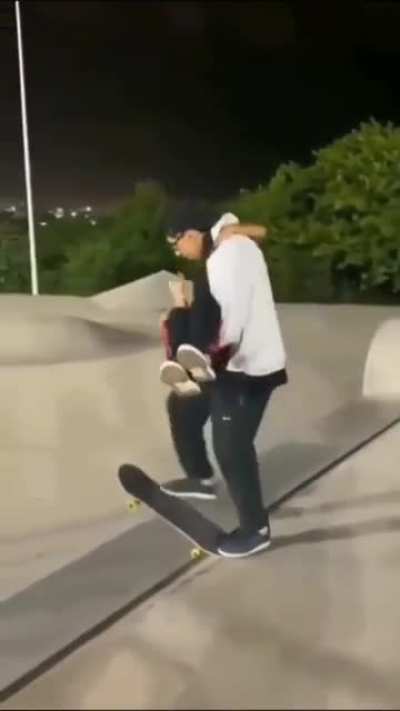 Skateboarding and lifting a girl