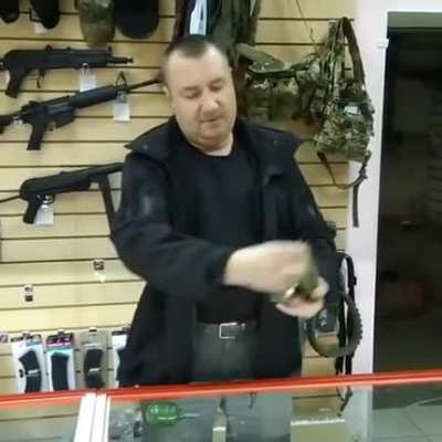 Russian man showing how to use a Grenade "safely"