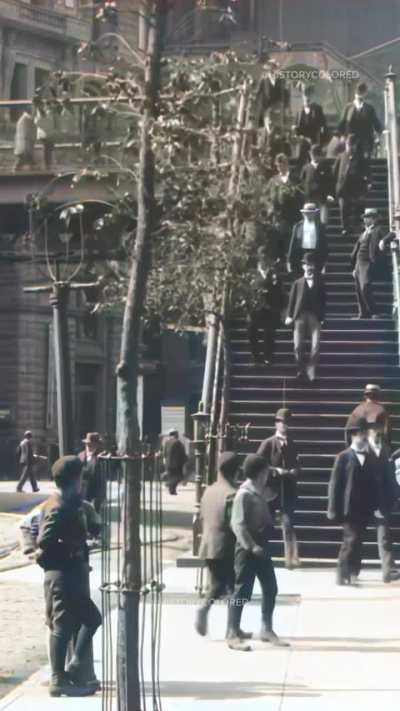 Restored footage from 1896 of pedestrians walking down the stairs of a foot-bridge onto the streets of New York City, United States. This footage was filmed by pioneering French filmmaker Alexandre Promio, who worked for the Lumi&egrave;re brothers assigned to m