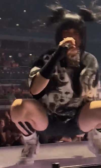 Billie Eilish bouncing on stage