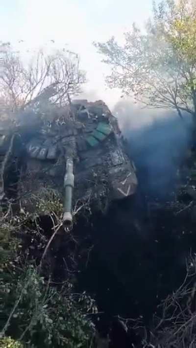 UA Pov: Ukrainian soldiers recovering functional Russian tank that was stuck in a ditch.