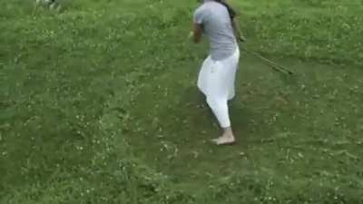 Scything lawn-length grass