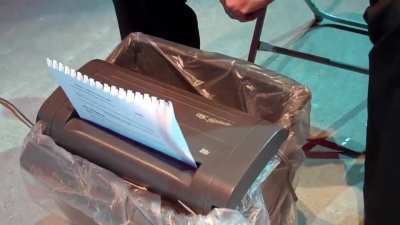 Guy shreds paper