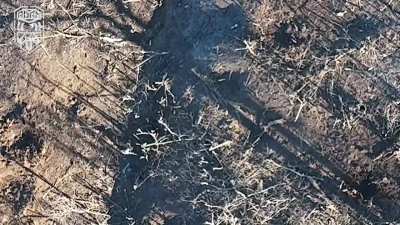 Adam unit drones attacking several Russian soldiers who are running back and forth trying to dodge the grenades