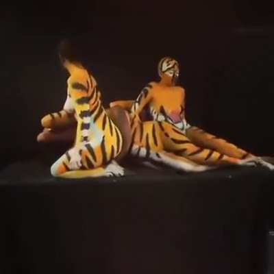 Bodypainted women forming a tiger