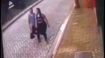 This couple dodging a car.