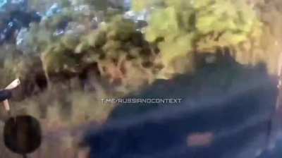 A Russian serviceman recorded the moment of the attack of a Ukrainian FPV drone on his camera.