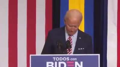 Joe Biden plays "Despacito" on his phone at a Hispanic heritage month event in Florida