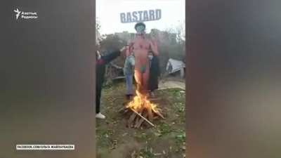 Kazakh women burn Borat cut out, ahead of it's worldwide premiere