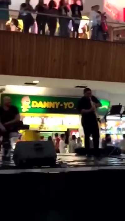 The mall started flooding so the live band starts to perform the Titanic song